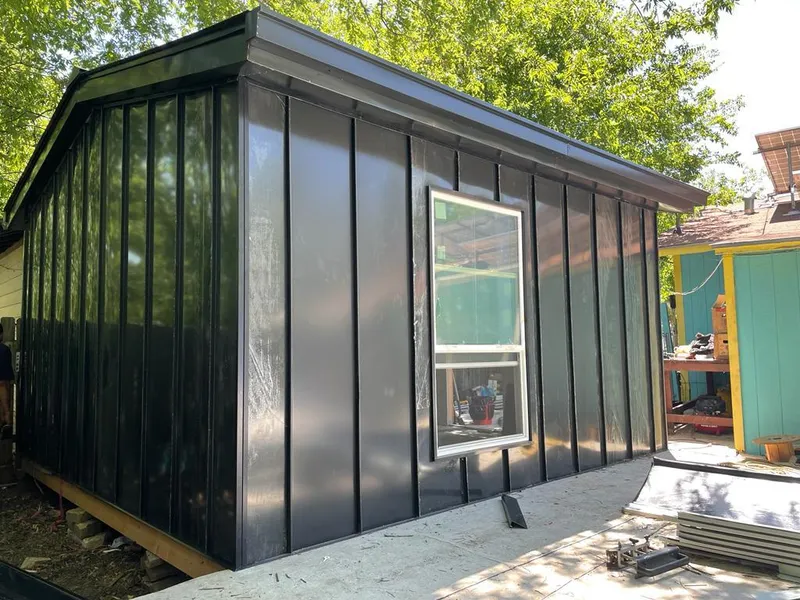 Black standing seam metal wall panels for Metal Roof Installation in Jasper